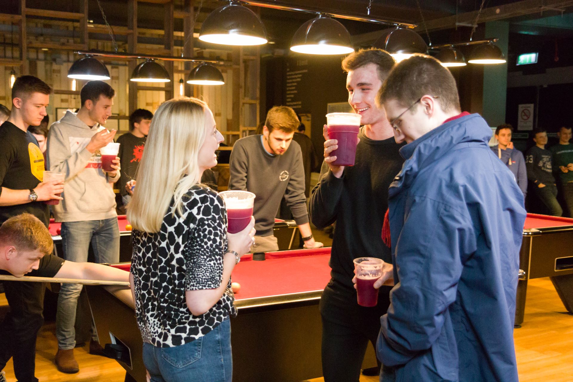 Group of students playing pool